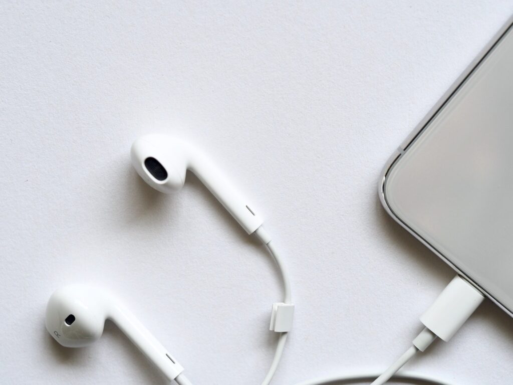 relationship podcast, cults, narcissistic abuse, exploring deeper - picture of headphones and iphone